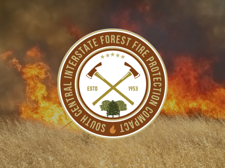 South Central Forest Fire Compact logo in front of a backdrop of a wildfire