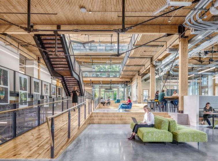 View of the interior of a mass timber building, with exposed wood interior